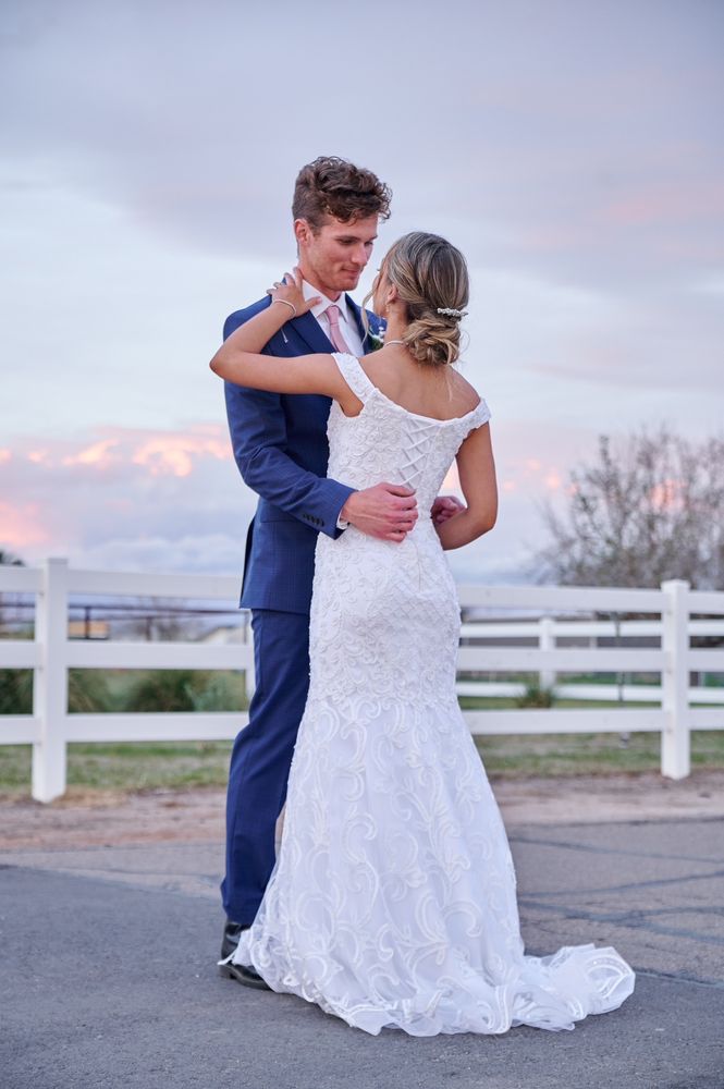 Bride and groom dancing at golden hour, bride in a fitted mermaid wedding dress - Strictly Weddings Phoenix AZ