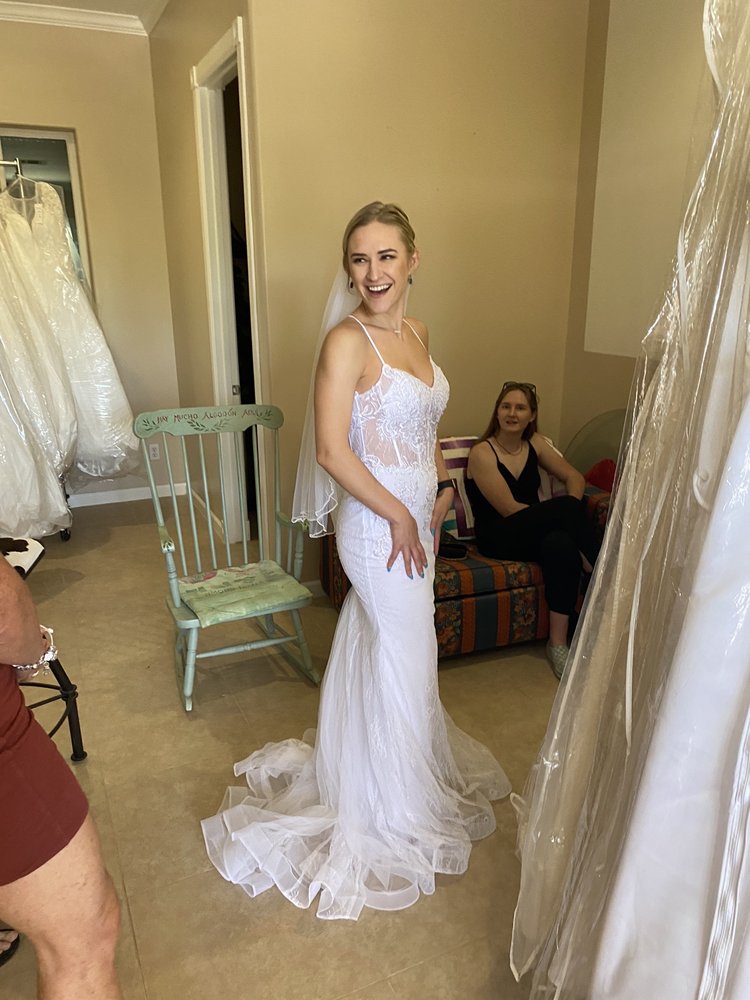 Bride in a fitted wedding dress at the Strictly Weddings showroom - Phoenix AZ