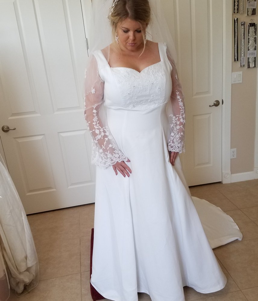 Plus size bride in a long-sleeve lace wedding dress - Strictly Weddings Phoenix AZ