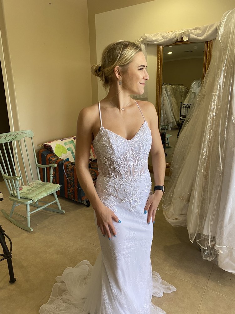 Inside the Strictly Weddings showroom in Laveen AZ with racks of wedding dresses